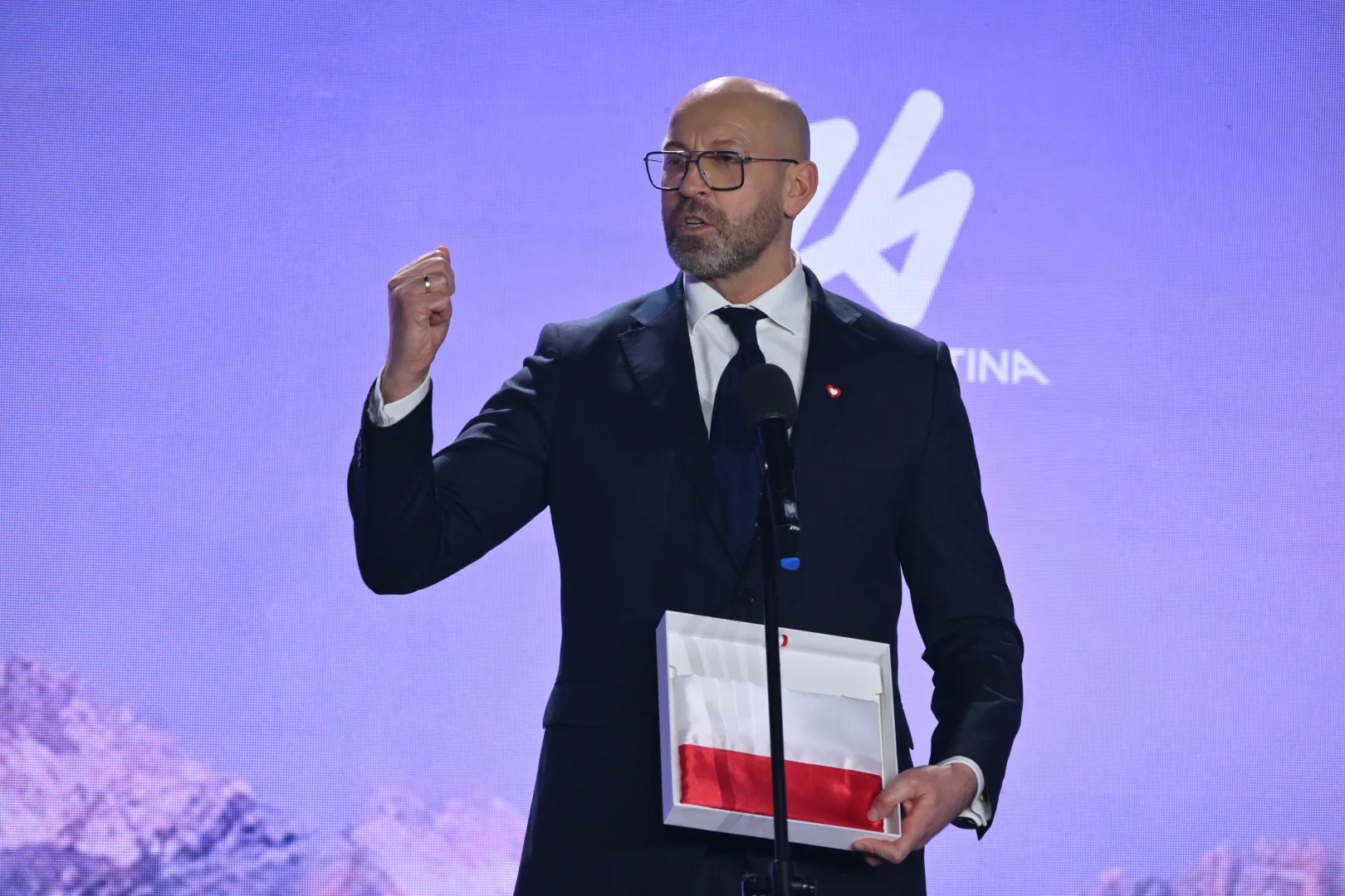 Minister sportu i turystyki Jakub Rutnicki przemawia podczas ceremonii ślubowania i wręczenia nominacji reprezentantom Polski na XXV Zimowe Igrzyska Olimpijskie Mediolan-Cortina 2026 Fot. PAP/Piotr Nowak