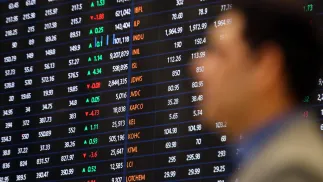 Trader na giełdzie Fot. PAP/EPA/REHAN KHAN