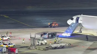 Funkcjonariusze Straży Granicznej podczas interwencji na lotnisku, fot. Straż Graniczna