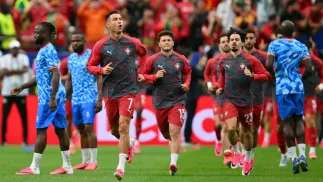 Rozgrzewka przed meczem Portugalia-DRK, fot. PAP/EPA/SAM WASSON